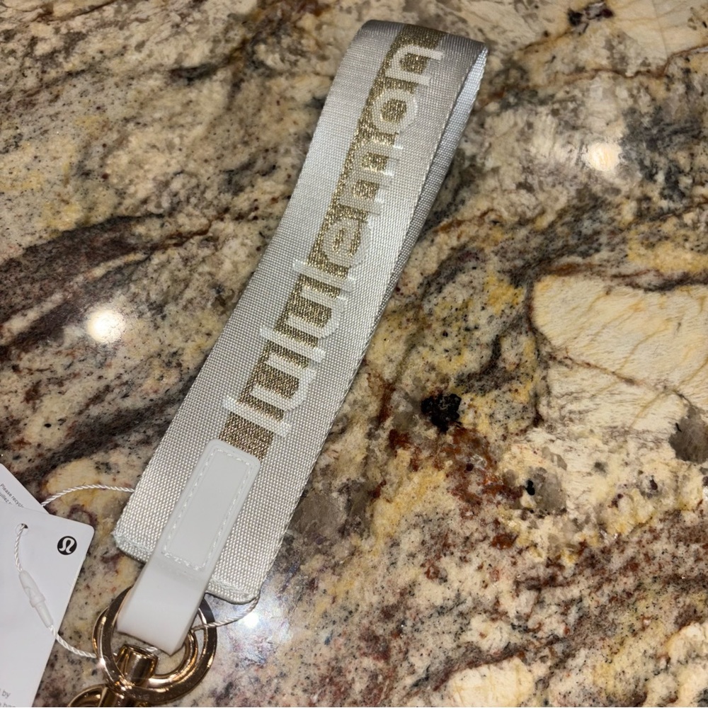 Lululemon Never Lost Keychain Vapor Gold Brand New NWT - Picture 2 of 5